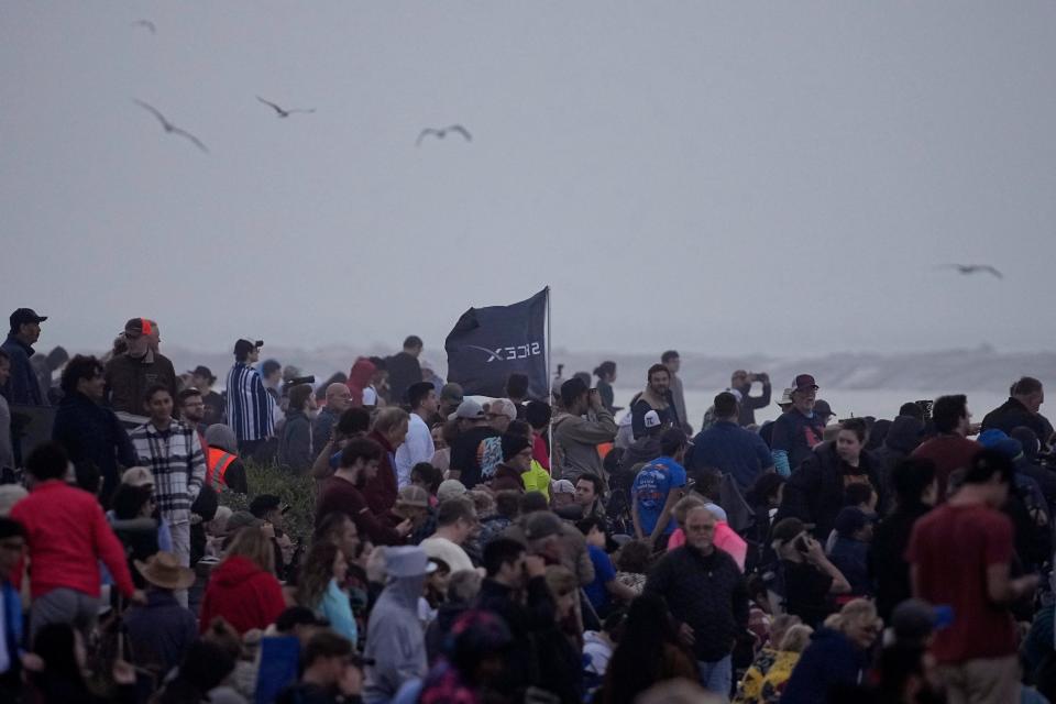 People gather to watch SpaceX's mega rocket Starship launch it's third test flight from Starbase in Boca Chica, Texas, Thursday, March 14, 2024.