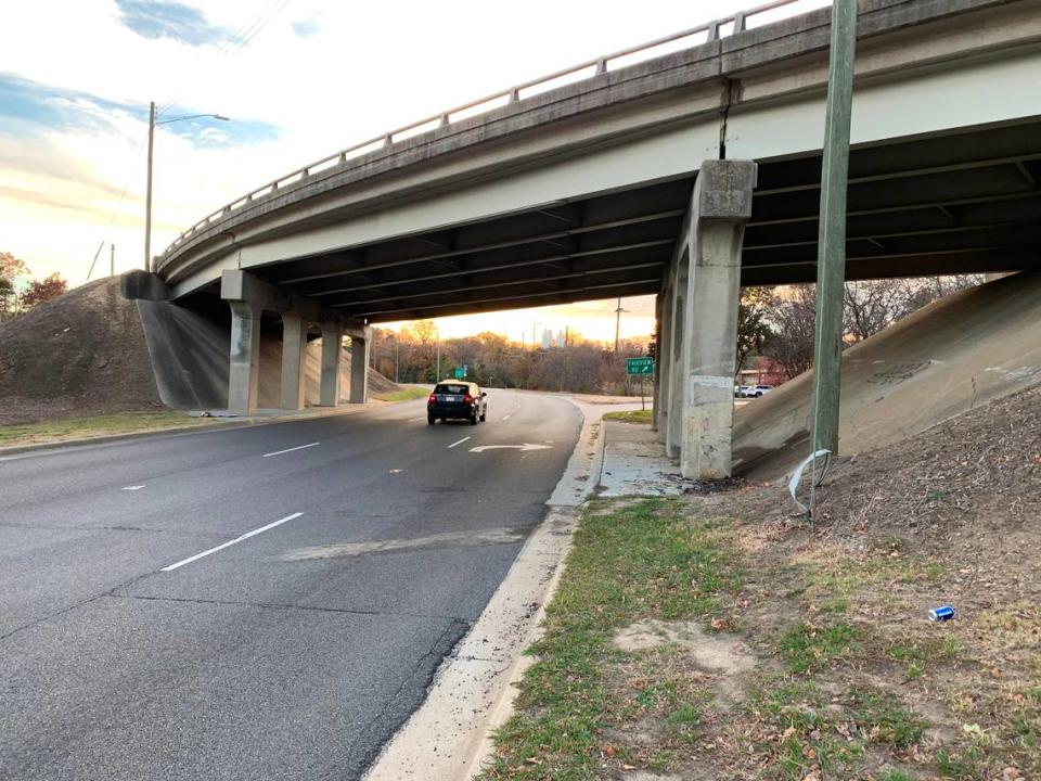 Contractors for The N.C. Department of Transportation will install guardrails where Capital Boulevard passes under the Fairview Road overpass. Five teens were killed in October 2021 when the SUV one of them was driving hit the bridge piers at right going 80 mph.