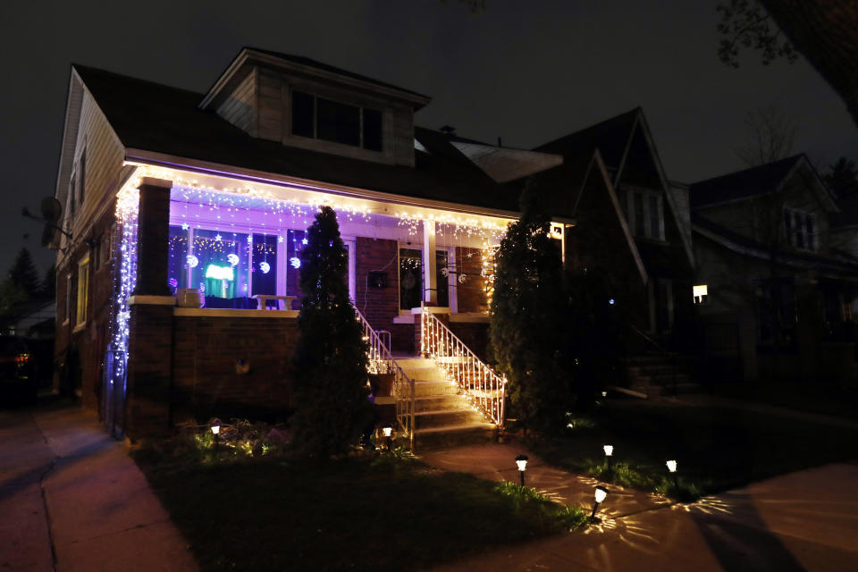 In this Tuesday, April 28, 2020 photo, Ramadan lights are displayed on a house in Dearborn, Mich. The Muslim community in Dearborn is starting a new tradition this year. The community is hosting a Ramadan lights competition in hopes of spreading joy and bringing back some of the holiday spirit during the coronavirus pandemic. (AP Photo/Carlos Osorio)