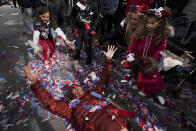 Ty Ansley celebrates during a victory parade for the Atlanta Braves , Friday, Nov. 5, 2021, in Atlanta. The Braves beat the Houston Astros 7-0 in Game 6 on Tuesday to win their first World Series baseball title in 26 years. (AP Photo/Brynn Anderson)