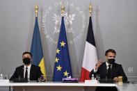 French President Emmanuel Macron and Ukrainian President Volodymyr Zelenskiy hold a news conference following their meeting at the Elysee Palace in Paris