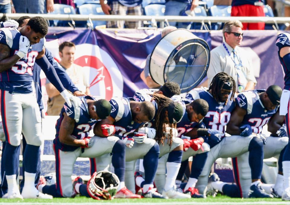 Some New England Patriots kneeled during the playing of the national anthem last season. (Getty Images)