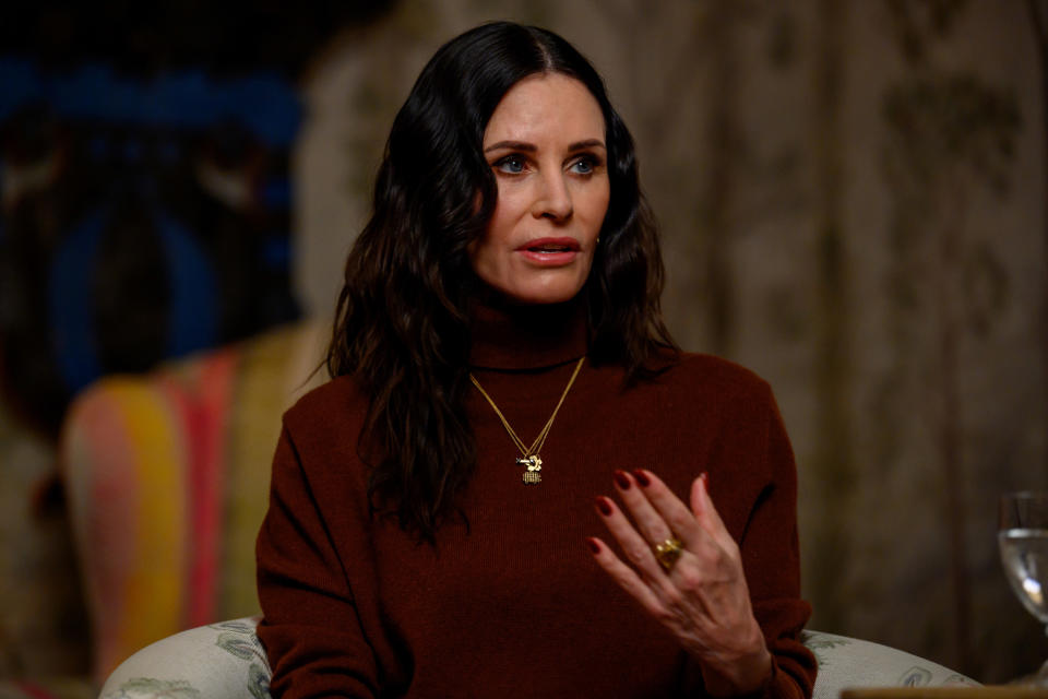 Courteney in a turtleneck sweater