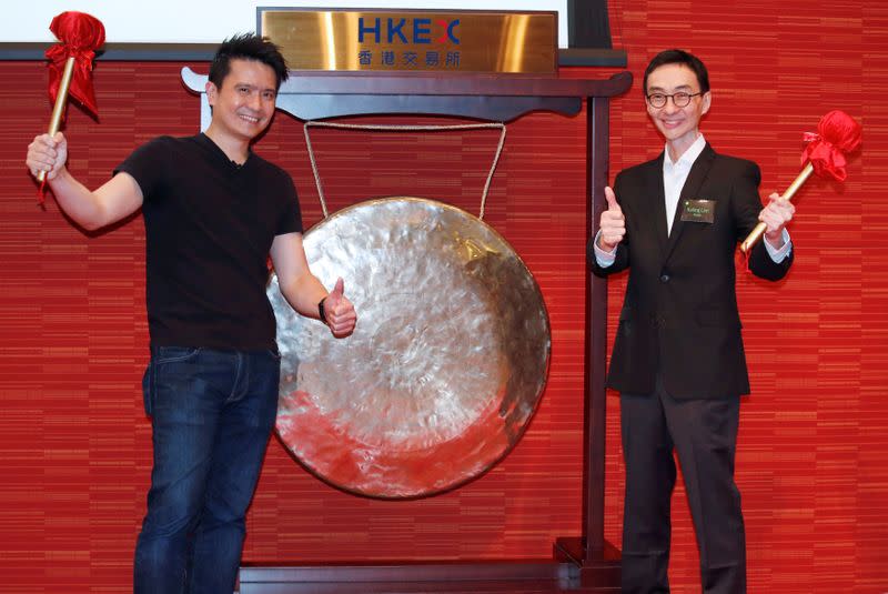 CEO of Razer Tan and non-executive director Lim pose during the debut of the company in Hong Kong