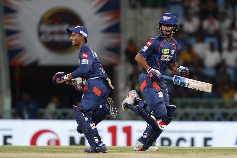 Lucknow Super Giants' Arshad Khan, right, and batting partner Ayush Badoni run between the wickets to score during the Indian Premier League cricket match between Lucknow Super Giants and Delhi Capitals in Lucknow, India, Friday, April 12, 2024. (AP Photo/Surjeet Yadav)