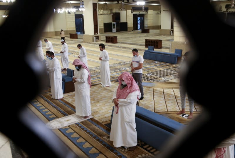 Muslims perform the Al-Fajr prayer inside the Al-Rajhi Mosque while practicing social distancing, after the announcement of the easing of lockdown measures amid the coronavirus disease (COVID-19) outbreak, in Riyadh