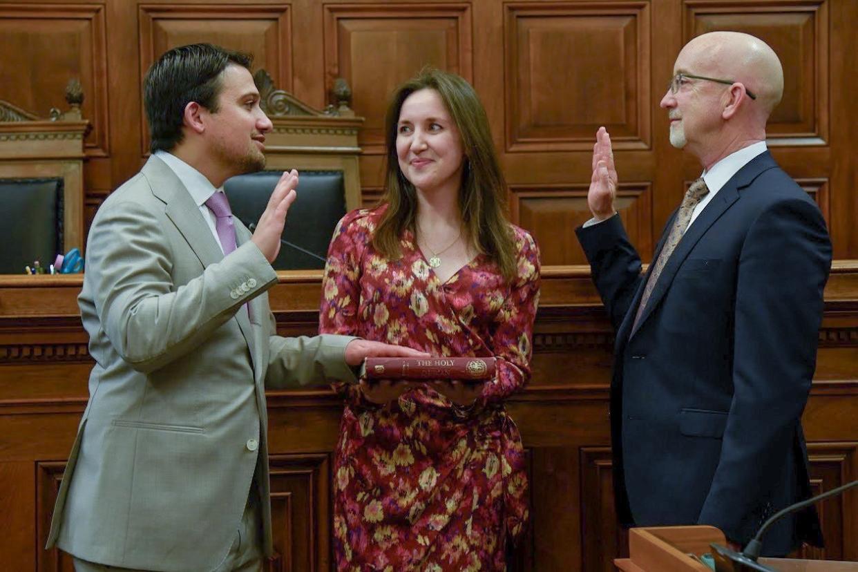 Shammas Malik (left) is sworn into office as Akron's next mayor on Jan. 1. He is joined by his partner, Alice Duey (center), and J. Bret Treier (right), a partner at Vorys, Sater, Seymour and Pease law firm.