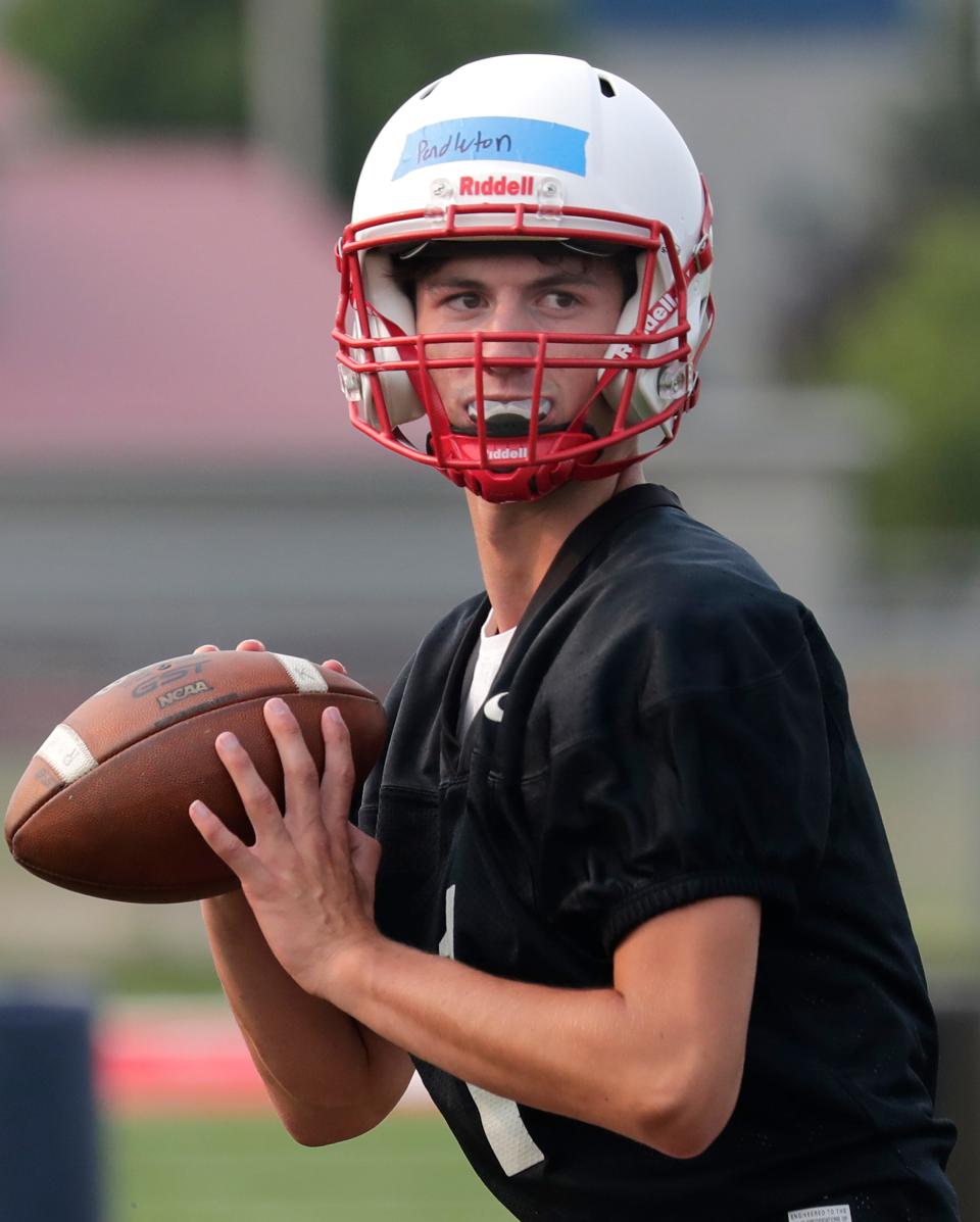 Kimberly's Carson Pendleton looks to pass during the Papermakers’ first practice of the season Tuesday in Kimberly.