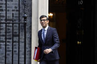 Britain's Prime Minister Rishi Sunak leaves 10 Downing Street to attend the weekly Prime Ministers' Questions session in parliament in London, Wednesday, March 22, 2023. (AP Photo/Kirsty Wigglesworth)