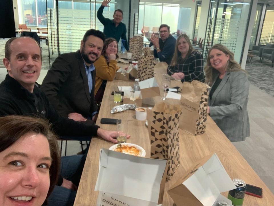 Some Systems Evolution, Inc., employees gather for a meal, post-pandemic.