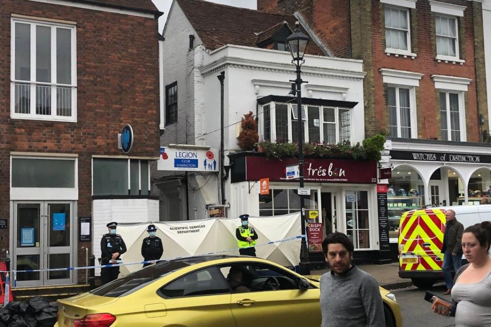 Police at the scene outside the Royal British Legion on High Street in Lymington, Hampshire (PA)