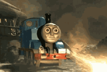 Thomas the Tank Engine sits by a burning fire