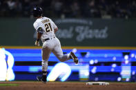 Milwaukee Brewers' Mark Canha rounds the bases after hitting a grand slam during the eighth inning of a baseball game against the Washington Nationals, Saturday, Sept. 16, 2023, in Milwaukee. (AP Photo/Aaron Gash)