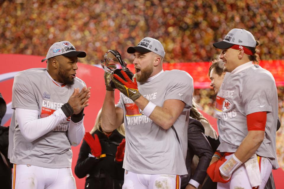 KANSAS CITY, MISSOURI - JANUARY 29: Travis Kelce #87 of the Kansas City Chiefs celebrates with the Lamar Hunt Trophy after defeating the Cincinnati Bengals 23-20 in the AFC Championship Game at GEHA Field at Arrowhead Stadium on January 29, 2023 in Kansas City, Missouri. (Photo by David Eulitt/Getty Images)