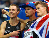 Bronze medalist Zane Robertson of New Zealand celebrates with Jake Robertson and Nick Willis of New Zealand.