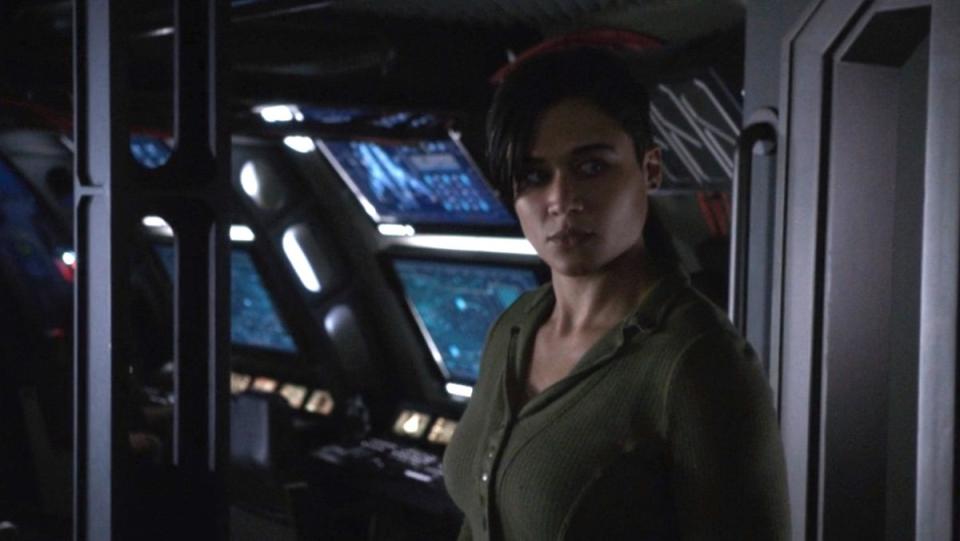 Katy O'Brian as Kimball standing inside a ship of Agents of S.H.I.E.L.D.
