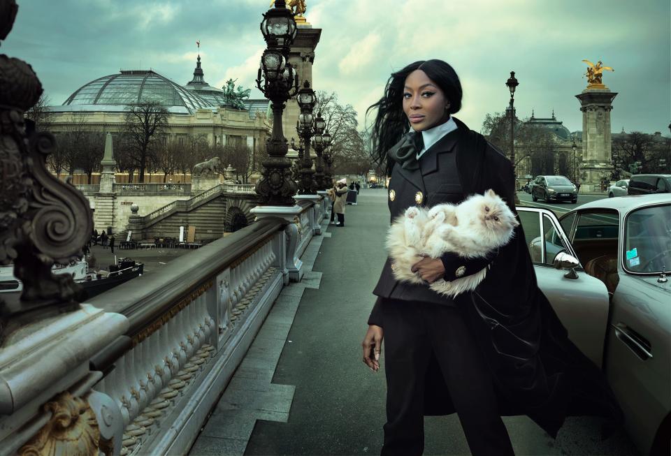 Naomi Campbell wears Balmain while holding Karl Lagerfeld's cat Choupette in the Vogue 2023 cover photoshoot.