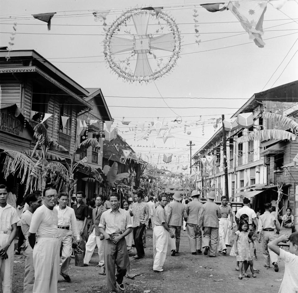 Traditional Philippino Christmas decorations hanging over the streets in the 1950s.