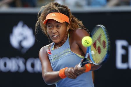 Tennis - Australian Open - Margaret Court Arena, Melbourne, Australia, January 22, 2018. Naomi Osaka of Japan hits a shot against Simona Halep of Romania. REUTERS/Issei Kato