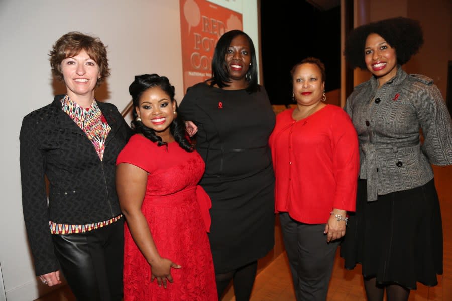NEW YORK, NY – MARCH 10: Activist Hydeia Broadbent (2nd L) poses with guests at the Red Pump Project Event Raising HIV/AIDS Awareness at Time Life Building on March 10, 2015, in New York City. (Photo by Johnny Nunez/WireImage)