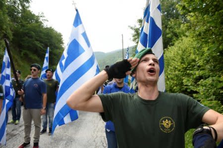 FILE PHOTO: Protesters chant the Greek national anthem during a demonstration against the agreement reached by Greece and Macedonia to resolve a dispute over the former Yugoslav republic's name, in Pisoderi village, northern Greece, June 17, 2018. REUTERS/Alexandros Avramidis/File Photo
