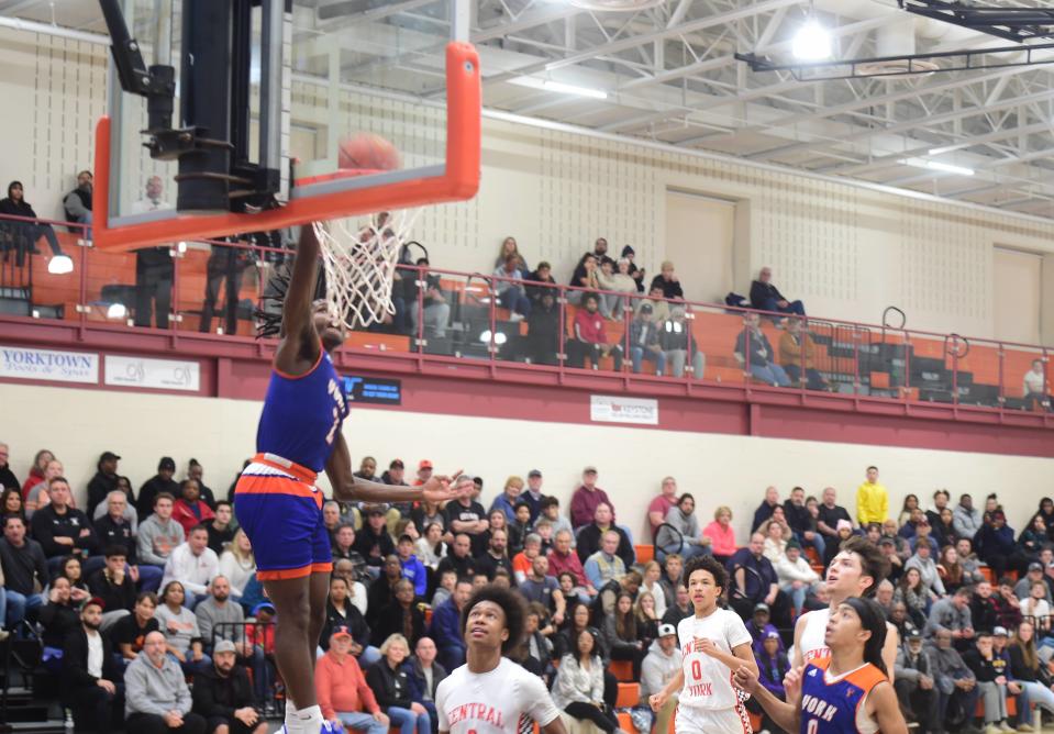 York High's Juelz Tucker throws down a dunk against Central York Tuesday. Central York beat York High, 68-65, at home Tuesday, Dec. 20, 2022.
