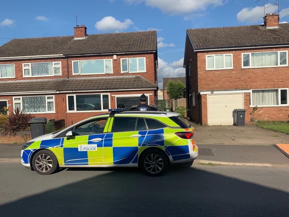 Police at the scene in Kidderminster, after David Louden and his three-year-old son Harrison were found dead (Josh Payne/PA) (PA Archive)