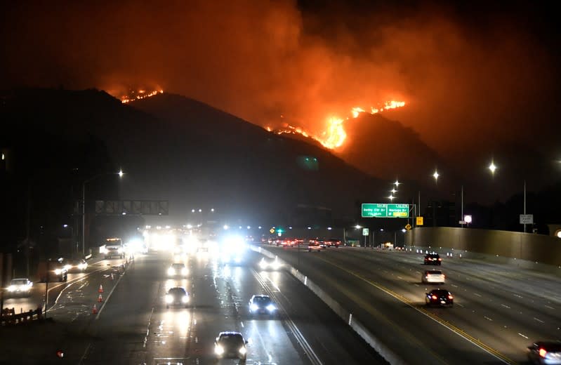 The Getty Fire burns next to the 405 freeway in the hills of West Los Angeles, California