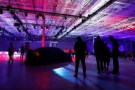 People look on before a reveal ceremony for the Volvo S60 during the inauguration of Volvo Cars first U.S. production plant in Ridgeville, South Carolina, U.S., June 20, 2018. REUTERS/Randall Hill