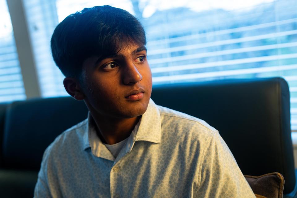 Kathir Kalyanaraman sits for a portrait Tuesday, Dec. 12, 2023, at his Johnston home. Kalyanaraman is the founder of the Tech Gift Foundation, which donates refurbished laptops and other personal electronics to refugees.