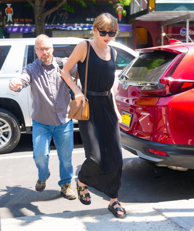 Taylor Swift Channels Her 1989 Era in a Belted Black Maxi Dress