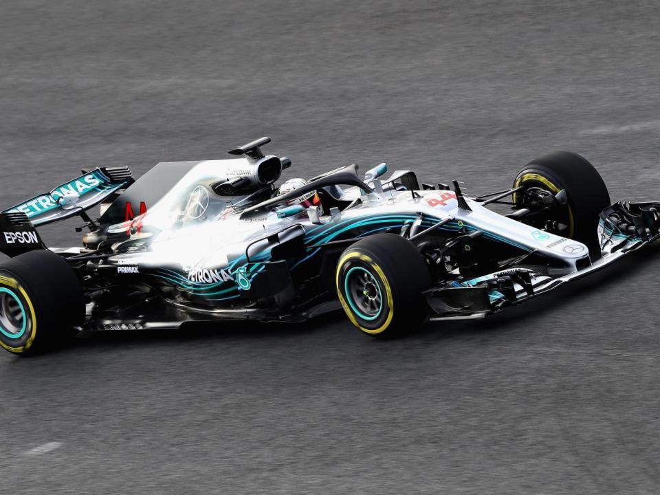 Both Hamilton and Bottas got behind the wheel of the new Mercedes to experience the Halo design (Getty)