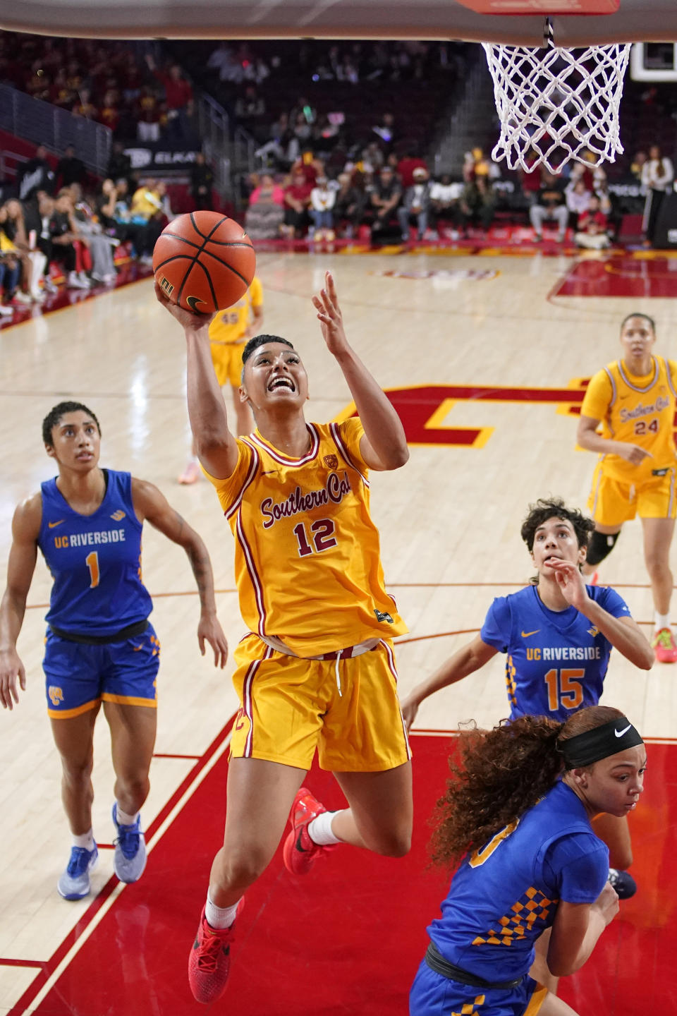 Southern California guard JuJu Watkins (12) shoots as UC Riverside forward Matehya Bryant (1), guard Jaden Sanderson (15) and guard Makayla Jackson (0) defend during the first half of an NCAA college basketball game Sunday, Dec. 10, 2023, in Los Angeles. (AP Photo/Mark J. Terrill)