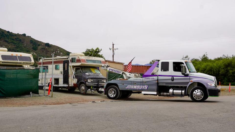 A tow truck removes an Oklahoma Avenue Safe Parking Site resident’s camper from the program site Sept. 15. A total of six residents were evicted for alleged incidents and threats of violence on the site. John Lynch/jlynch@thetribunenews.com