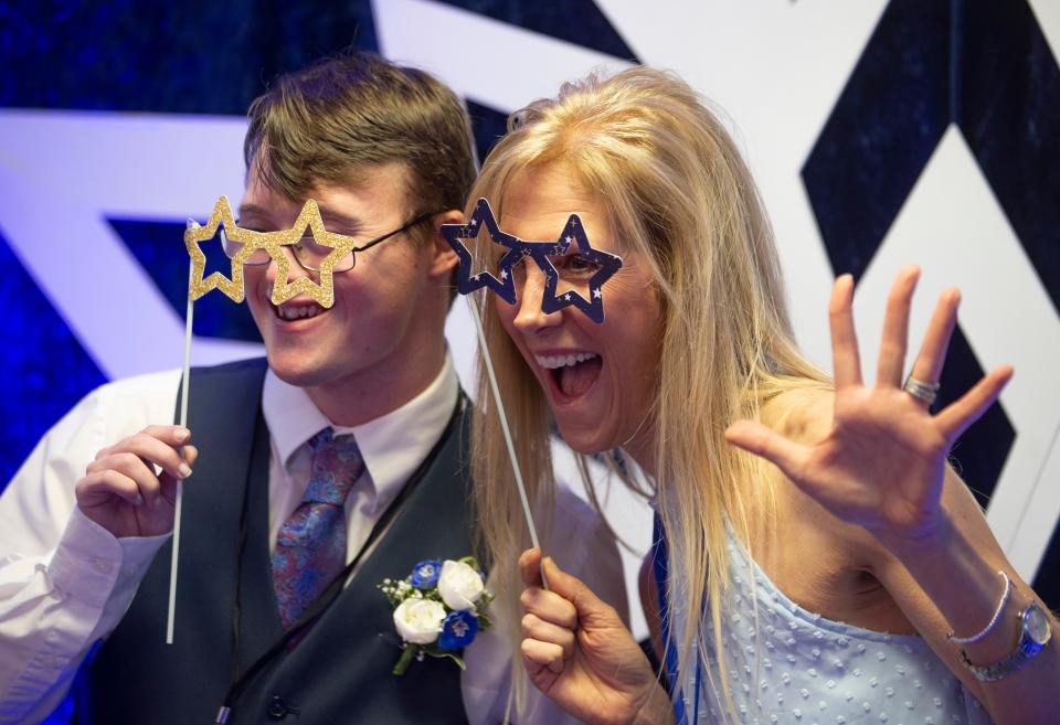 Brendan Bukowski and Kristen Howe have a photo taken at a photo booth at the "Night to Shine" gala for special-needs teens and adults at the Presbyterian Church of Toms River.  
Toms River, NJ
Friday, February 9, 2024