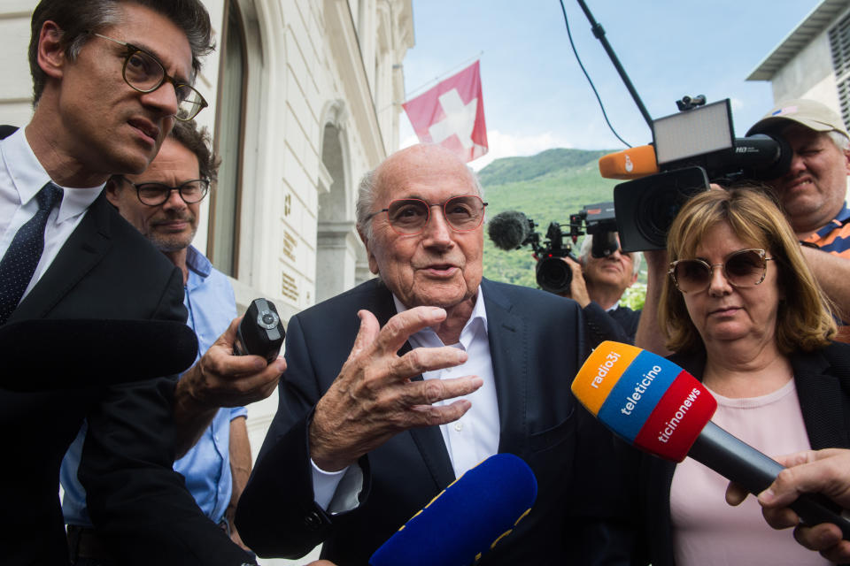 FILE - Former FIFA president Sepp Blatter is surrounded by the media as he leaves the Swiss Federal Criminal Court in Bellinzona, Switzerland, Wednesday, June 8, 2022. Blatter said on Tuesday, Nov. 8, 2022, that picking Qatar to host the World Cup was a mistake 12 years ago. (Alessandro Crinari/Keystone via AP, File)