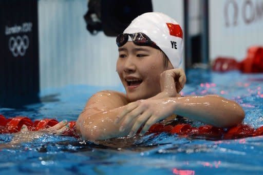 China's Ye Shiwen celebrates after winning the London Olympics women's 200m individual medley final during the swimming event on July 31. Ye added the 200m individual medley title to the 400m individual medley crown