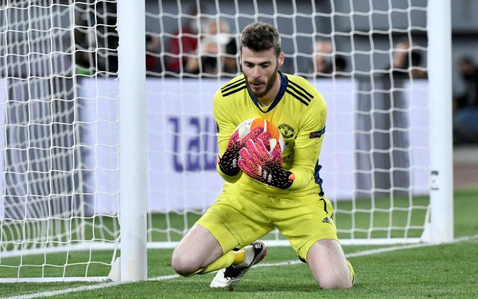 Manchester United's Spanish goalkeeper David De Gea stops the ball during the UEFA Europa League semi-final - FILIPPO MONTEFORTE/AFP via Getty Images