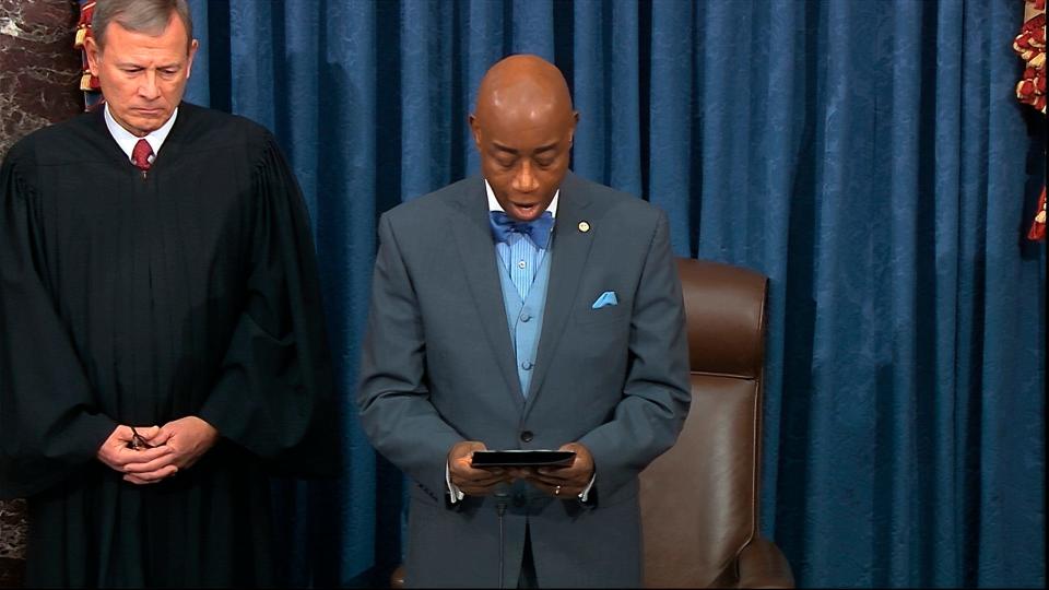 In this image from video, as presiding officer Chief Justice of the United States John Roberts listens Senate chaplain retired Navy Adm. Barry Black gives the opening prayer during the impeachment trial against President Donald Trump in the Senate at the U.S. Capitol in Washington, Wednesday, Jan. 29, 2020. (Senate Television via AP) ORG XMIT: DCJE102