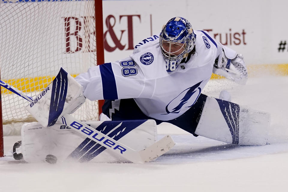 Tampa Bay Lightning goaltender Andrei Vasilevskiy (88) stops the puck during the second period in Game 5 of an NHL hockey Stanley Cup first-round playoff series against the Florida Panthers, Monday, May 24, 2021, in Sunrise, Fla. (AP Photo/Lynne Sladky)