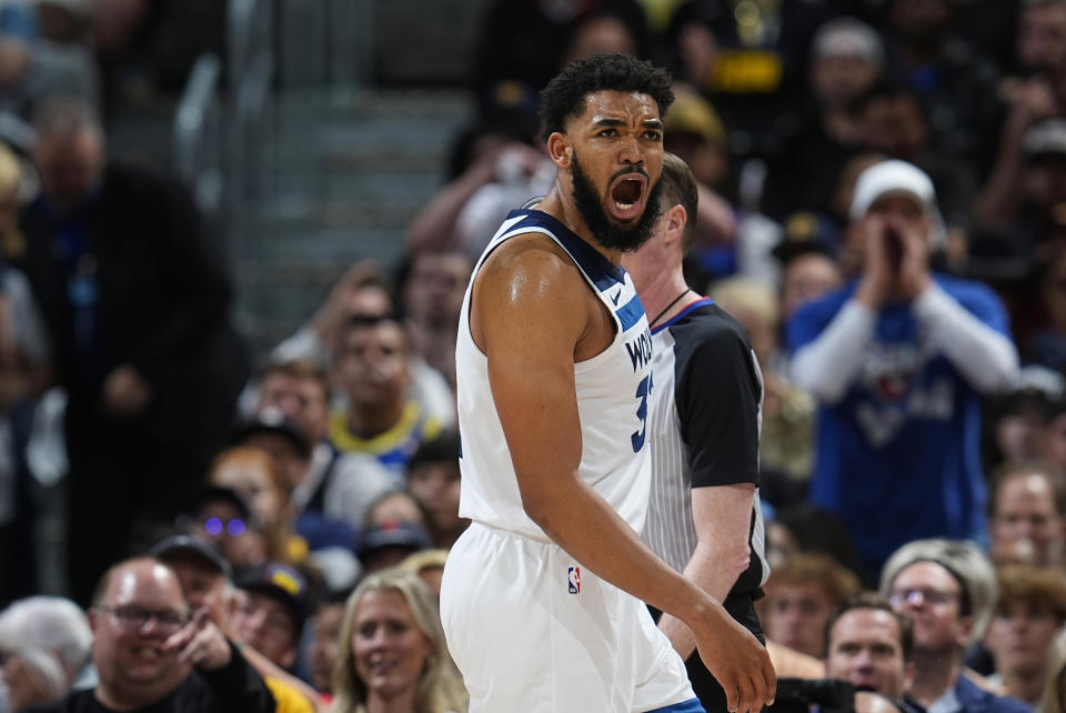 Minnesota Timberwolves center Karl-Anthony Towns reacts after he was called for a foul against the Denver Nuggets during the second half of Game 5 of an NBA basketball second-round playoff series Tuesday, May 14, 2024, in Denver (AP Photo/David Zalubowski)