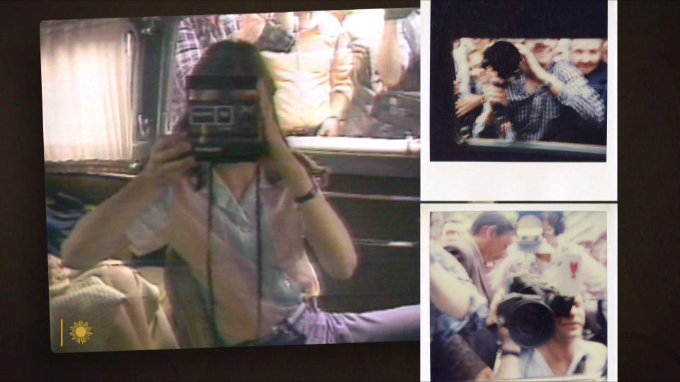 Samantha Smith taking Polaroid pictures of the international press taking her picture during her visit to the Soviet Union.   / Credit: CBS News