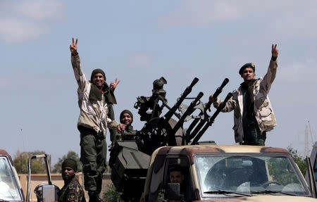Libyan National Army (LNA) members, commanded by Khalifa Haftar, head out of Benghazi to reinforce the troops advancing to Tripoli, in Benghazi, Libya April 7, 2019. REUTERS/Esam Omran Al-Fetori/Files