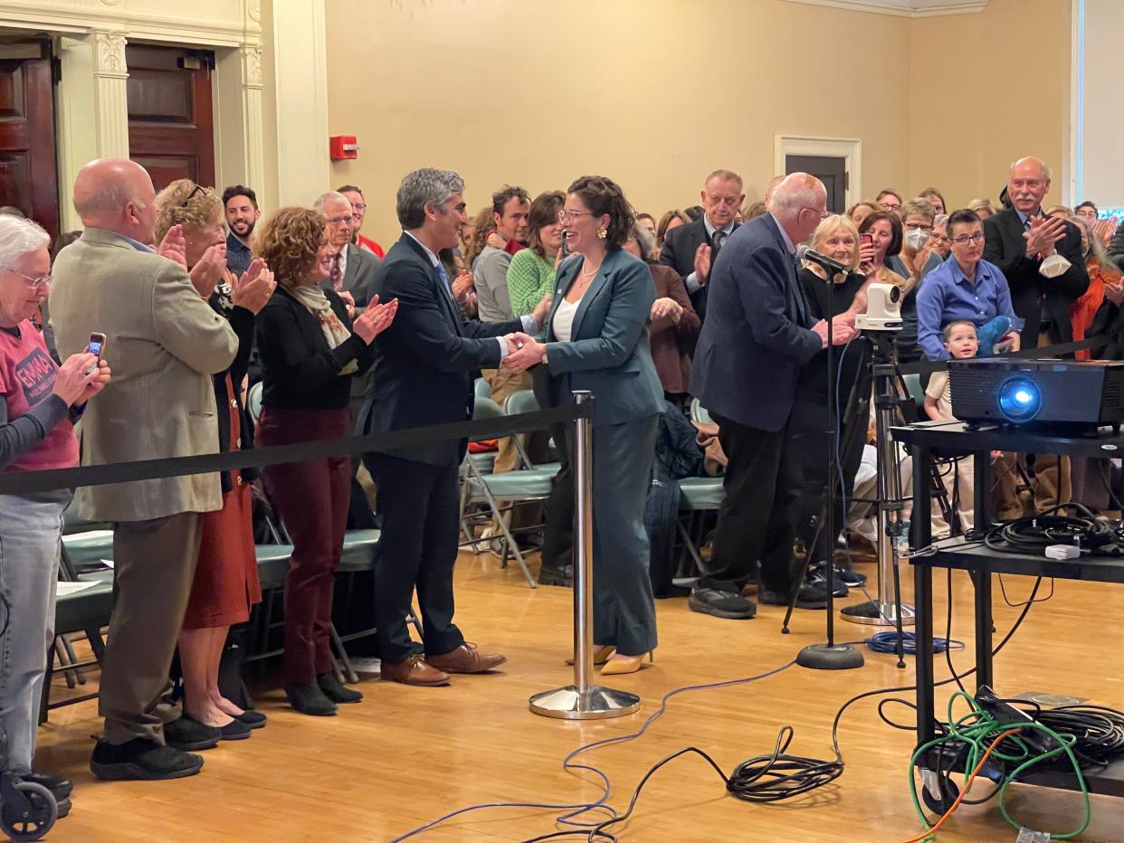 Mayor-elect Emma Mulvaney-Stanak shakes hands with Mayor Miro Weinberger before she is sworn in as mayor April 1, 2024.