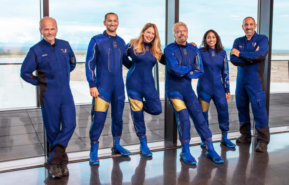 FILE - This image provided by Virgin Galactic shows, from left, Chief Pilot Dave Mackay, Lead Operations Engineer Colin Bennett, Chief Astronaut Instructor Beth Moses, Founder of Virgin Galactic Richard Branson, Vice President of Government Affairs and Research Operations Sirisha Bandla and pilot Michael Masucci. Just a week shy of turning 71, the London-born founder of the Virgin Group will become only the second septuagenarian in space. (Virgin Galactic via AP, File)