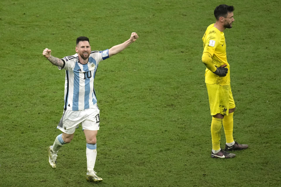 Argentina's Lionel Messi celebrates his side's their goal as France's goalkeeper Hugo Lloris stands during the World Cup final soccer match between Argentina and France at the Lusail Stadium in Lusail, Qatar, Sunday, Dec. 18, 2022. (AP Photo/Christophe Ena)