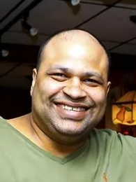 In this March 5, 2019, file photo, Hamilton Rodrigues, one of the new owners of Brockton's historic George's Cafe, poses for a photograph inside the Belmont Street restaurant.