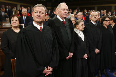 U.S. Supreme Court Justices, including Chief Justice John Roberts (L), arrive in the House chamber prior to U.S. President Barack Obama's final State of the Union address to a joint session of Congress in Washington January 12, 2016. REUTERS/Evan Vucci/Pool