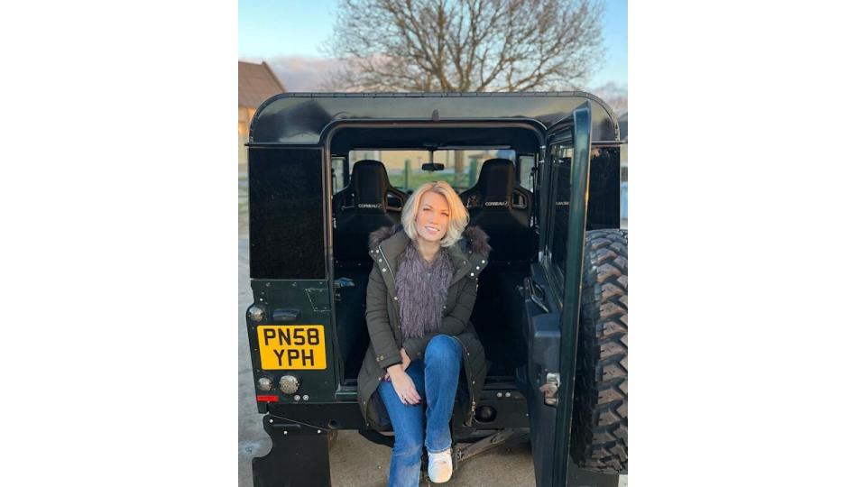 Steve Fletcher's daughter Amelia Hutchins sitting in a Land Rover