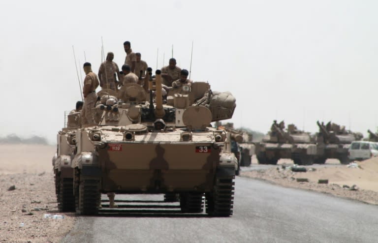 Tanks and armoured vehicles of the Saudi-led coalition are deployed on the outskirts of Aden on August 3, 2015, during a military operation against Shiite Huthi rebels and their allies